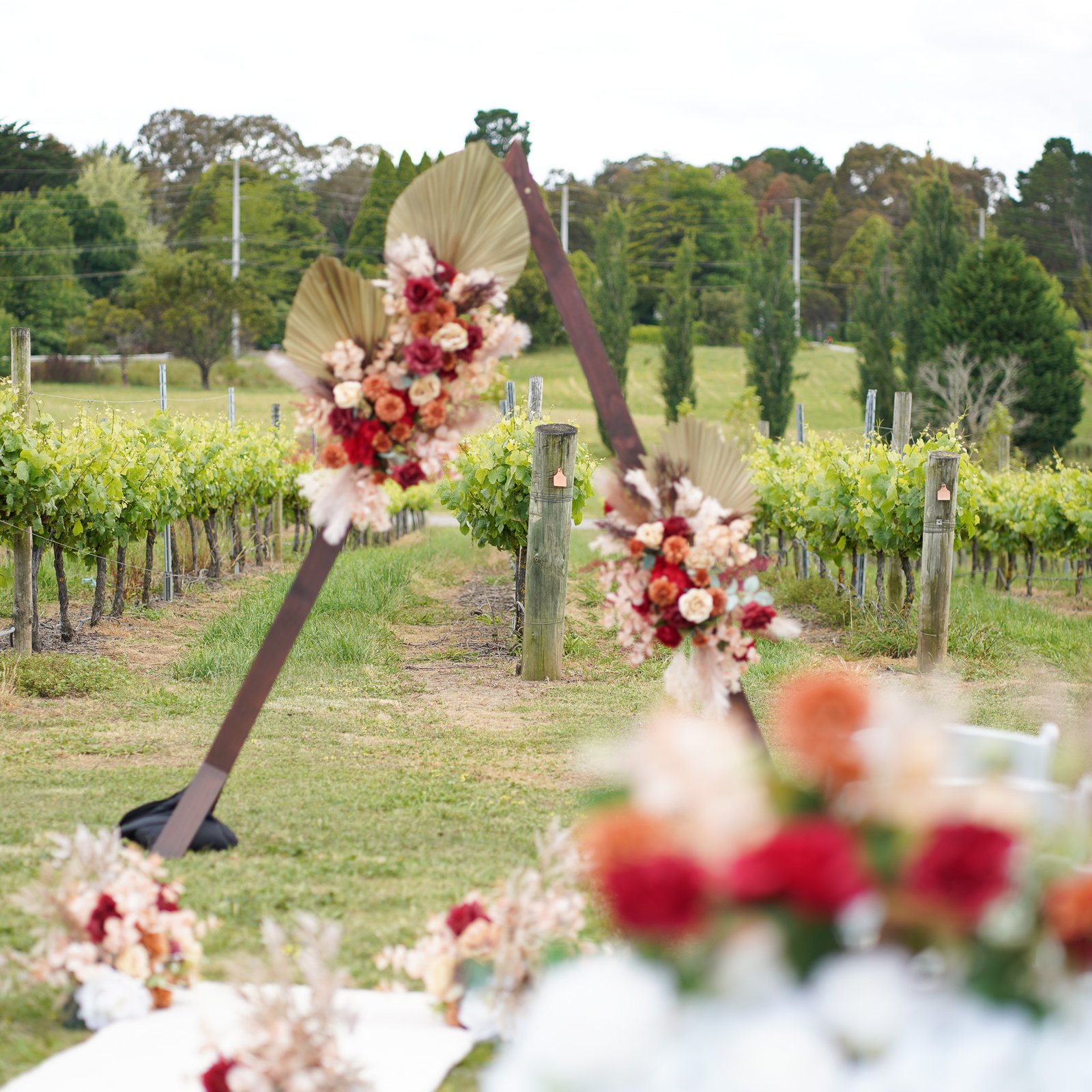 Triangular Wooden Arbor Adorned with Exquisite Flower Arrangements